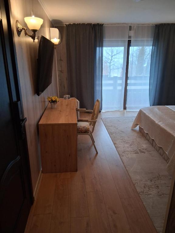 Postel nebo postele na pokoji v ubytování Hanu lu Mos Opinca