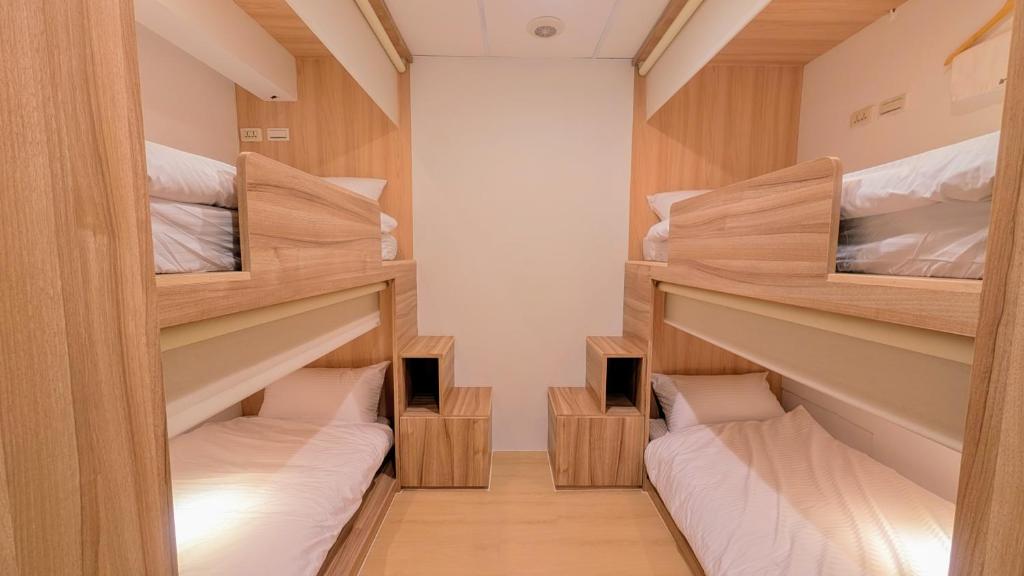 Postel nebo postele na pokoji v ubytování Yen Inn