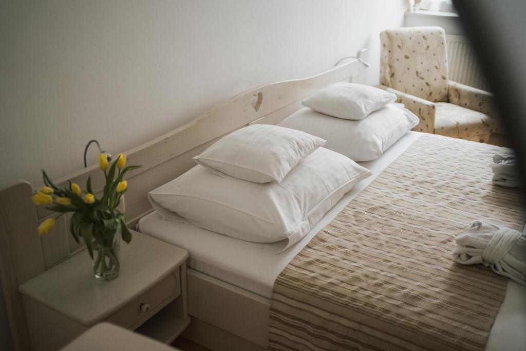 Posteľ alebo postele v izbe v ubytovaní Tornácos Hotel - Hegykő