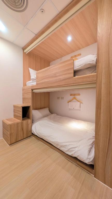 Postel nebo postele na pokoji v ubytování Yen Inn