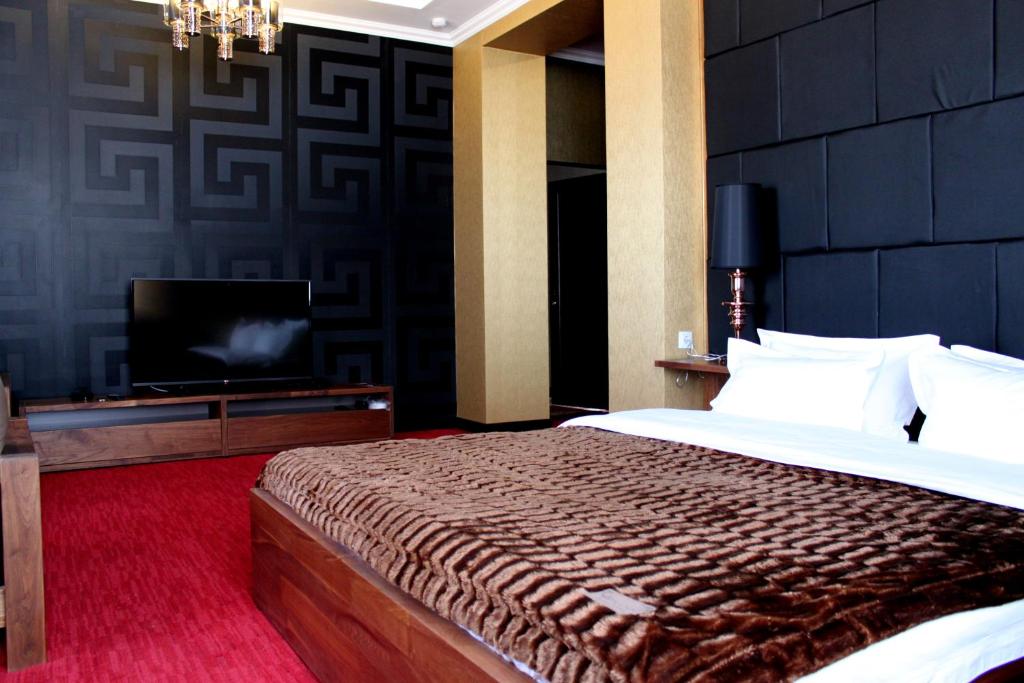 Postel nebo postele na pokoji v ubytování Astor Hotel & Spa