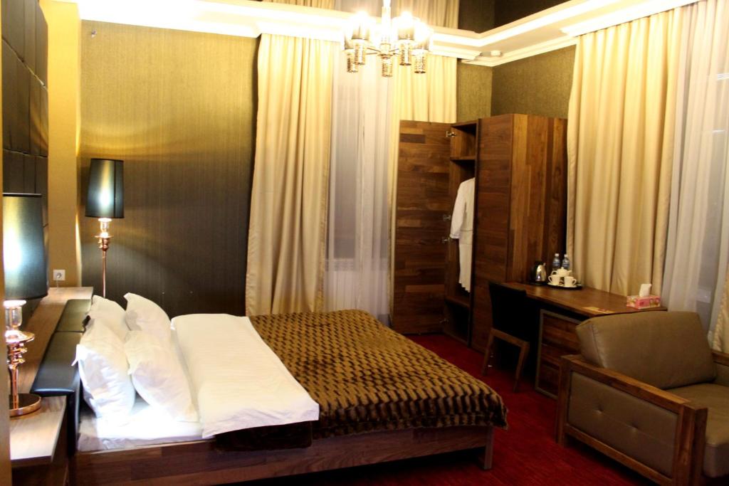 Postel nebo postele na pokoji v ubytování Astor Hotel & Spa