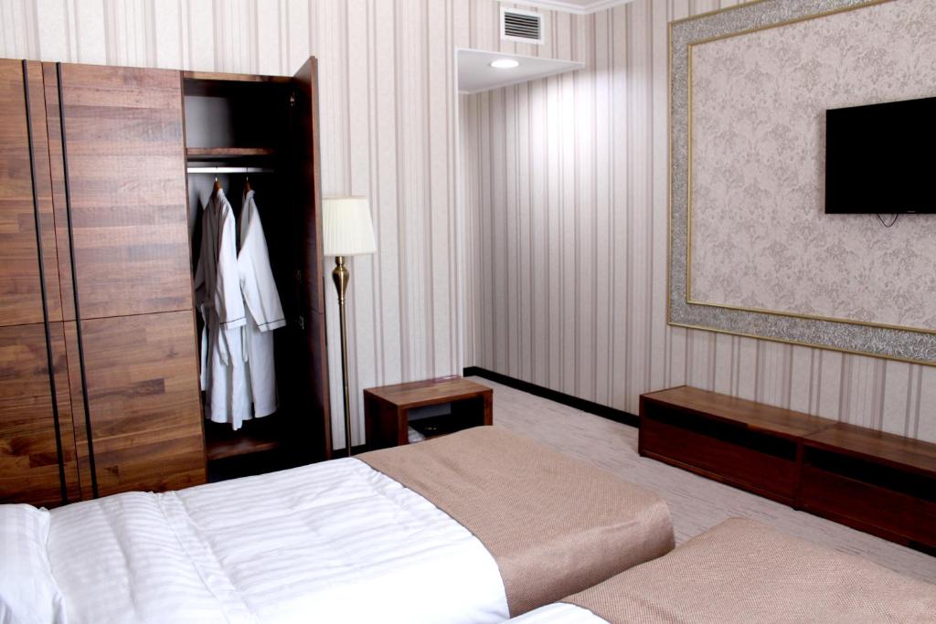 Postel nebo postele na pokoji v ubytování Astor Hotel & Spa