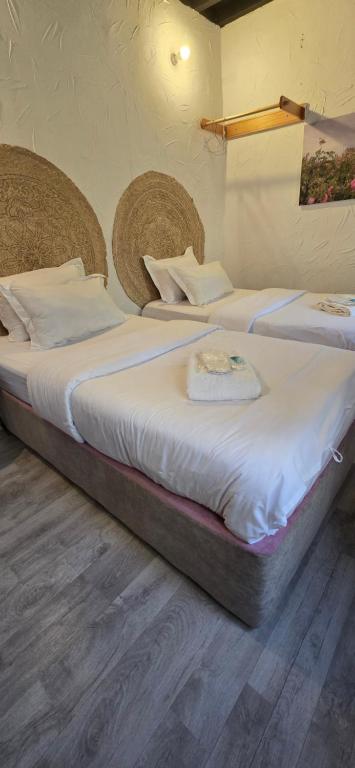 Postel nebo postele na pokoji v ubytování Riad Nizwa