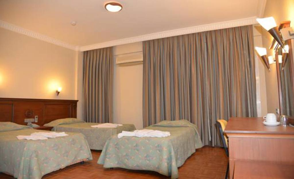 Postel nebo postele na pokoji v ubytování Fidan Apart Hotel