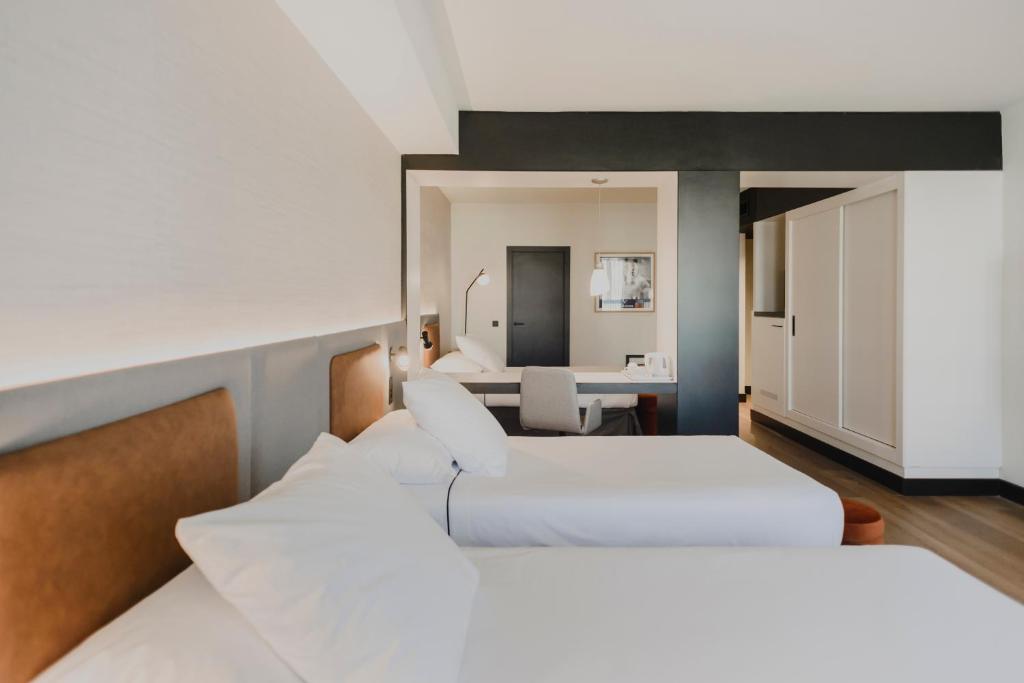 Posteľ alebo postele v izbe v ubytovaní Hotel Dimar