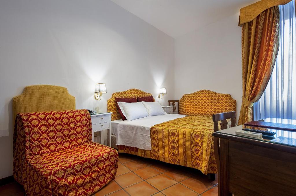 Cama ou camas em um quarto em Hotel Canova