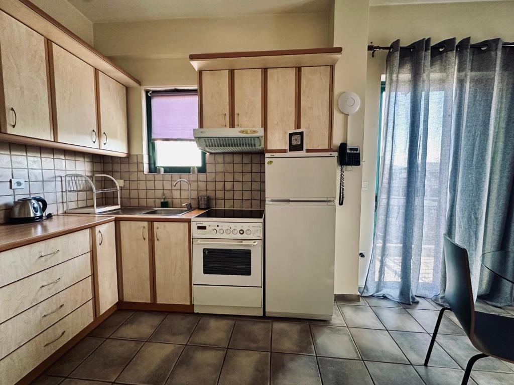 Kuchyňa alebo kuchynka v ubytovaní Cozy Apartments Mc Queen