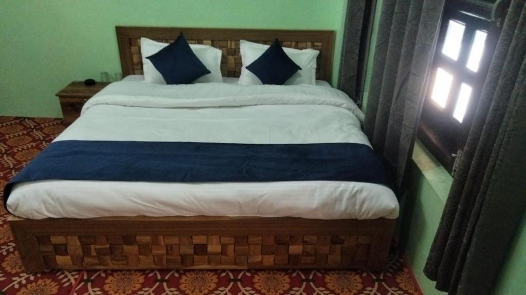 Postel nebo postele na pokoji v ubytování Hotel River View
