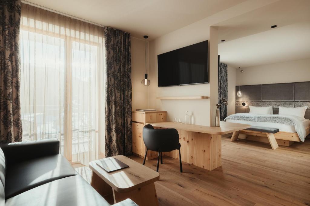 Postel nebo postele na pokoji v ubytování Hotel Tofana Cortina