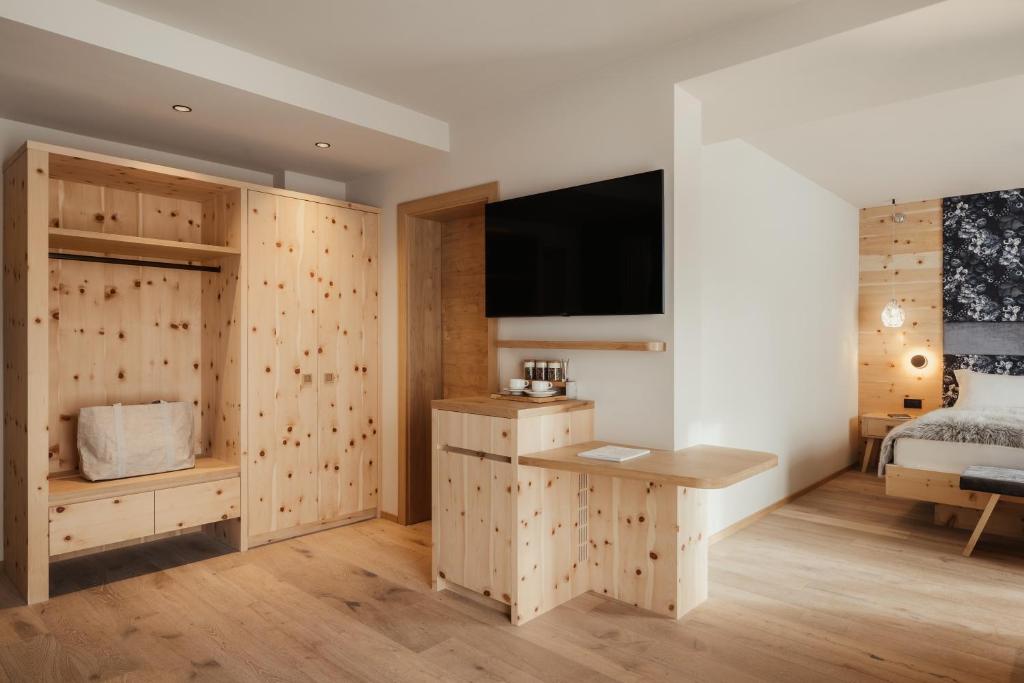 TV a/nebo společenská místnost v ubytování Hotel Tofana Cortina