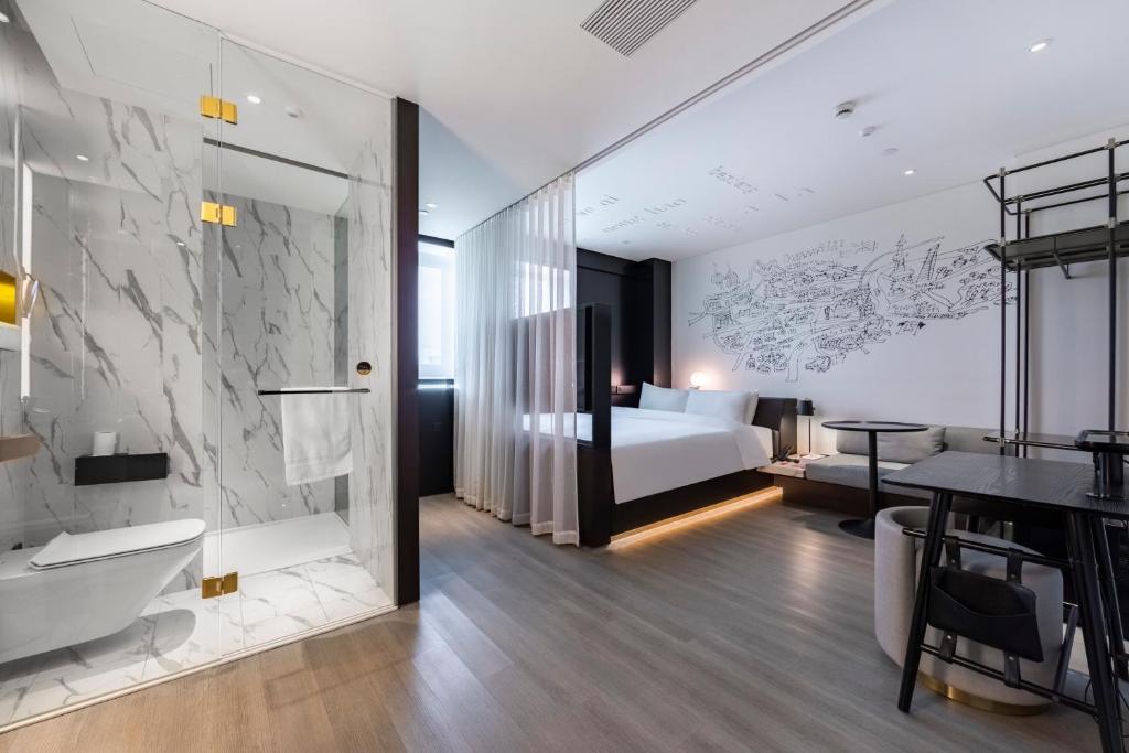 Postel nebo postele na pokoji v ubytování CitiGO Hotel Hongqiao Shanghai
