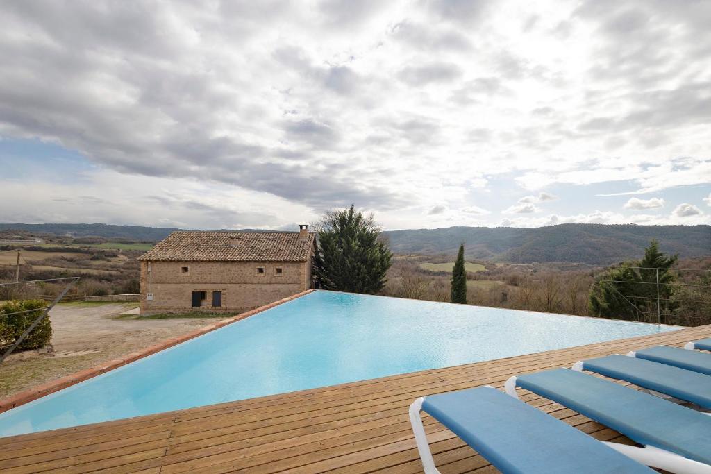 Bazén v ubytování El Pujol nebo v jeho okolí