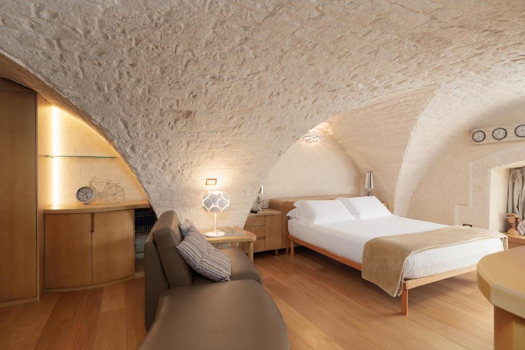 Postel nebo postele na pokoji v ubytování Suite Mameli Ostuni