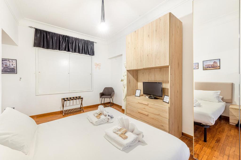 Łóżko lub łóżka w pokoju w obiekcie Giulia Apartment