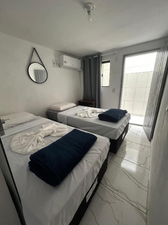 Postel nebo postele na pokoji v ubytování A casa roxinha