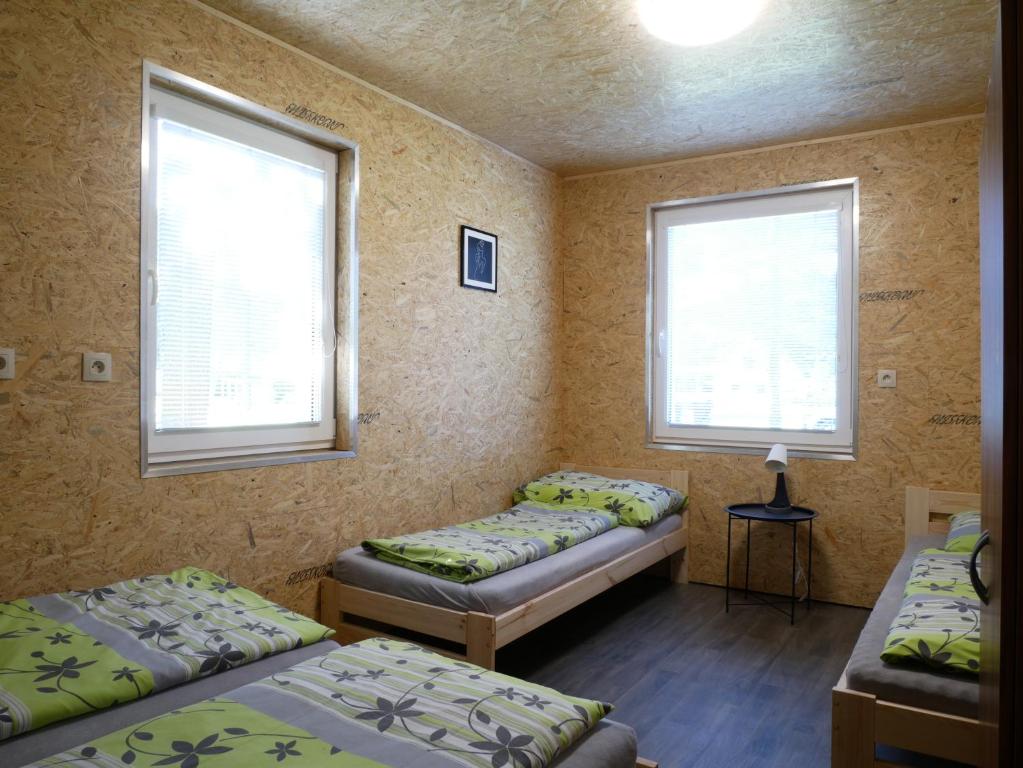 Postel nebo postele na pokoji v ubytování Camping Rožnov