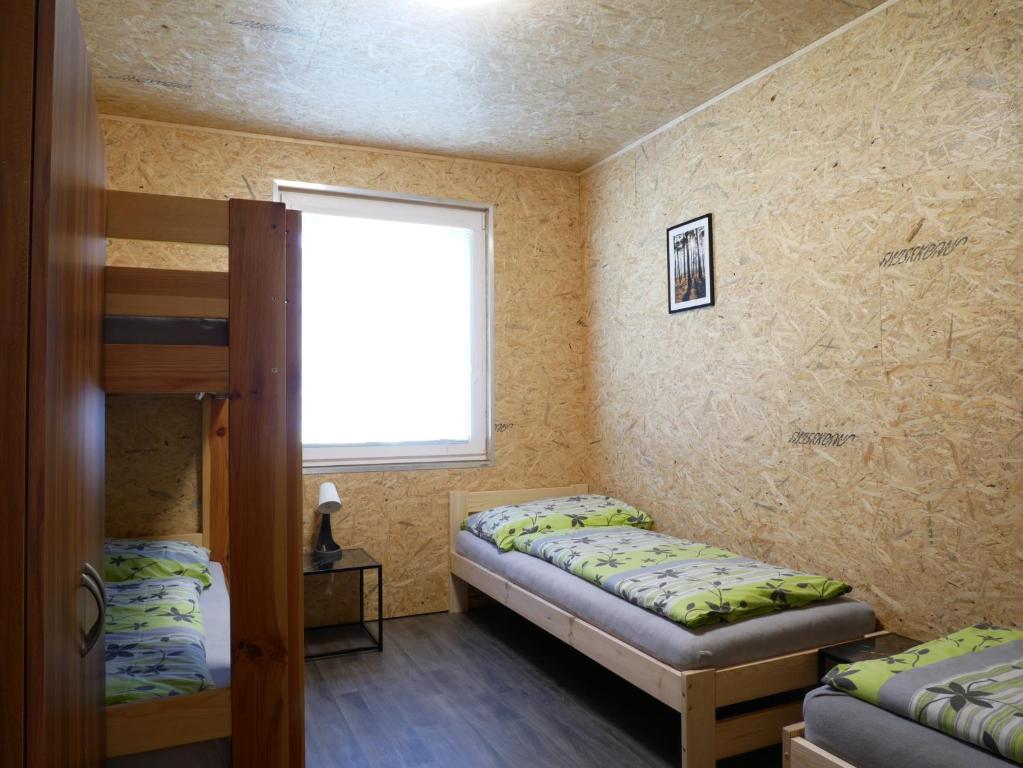 Postel nebo postele na pokoji v ubytování Camping Rožnov