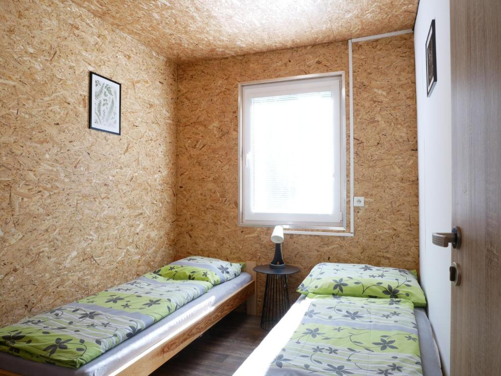 Postel nebo postele na pokoji v ubytování Camping Rožnov