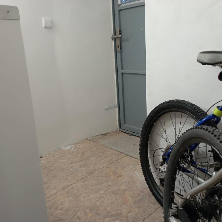 a bike parked in front of a door at Apartmán Putim in Písek