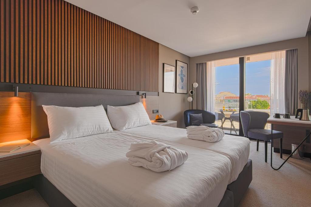 Postel nebo postele na pokoji v ubytování Boutique Hotel Noemia