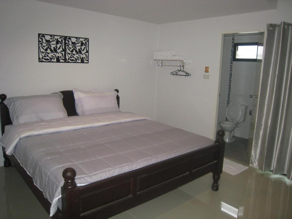 Postel nebo postele na pokoji v ubytování Ma Room Place Sukhothai Resort