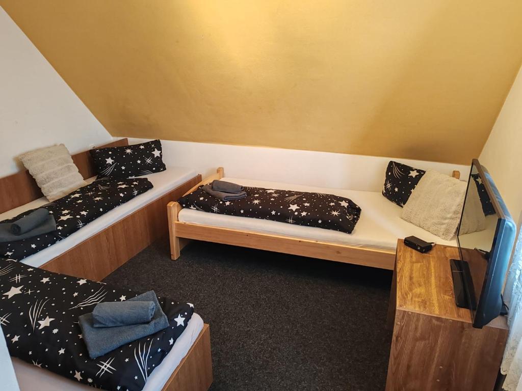 Postel nebo postele na pokoji v ubytování Restaurace a penzion Lutena