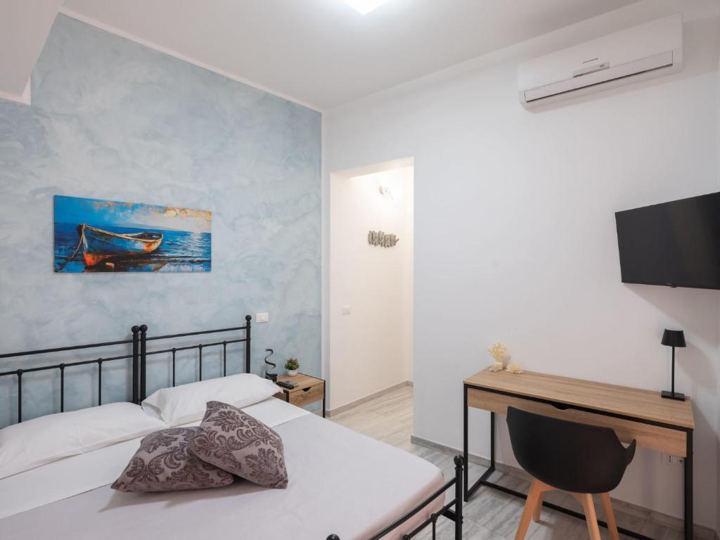 Postel nebo postele na pokoji v ubytování Agorà di Favignana