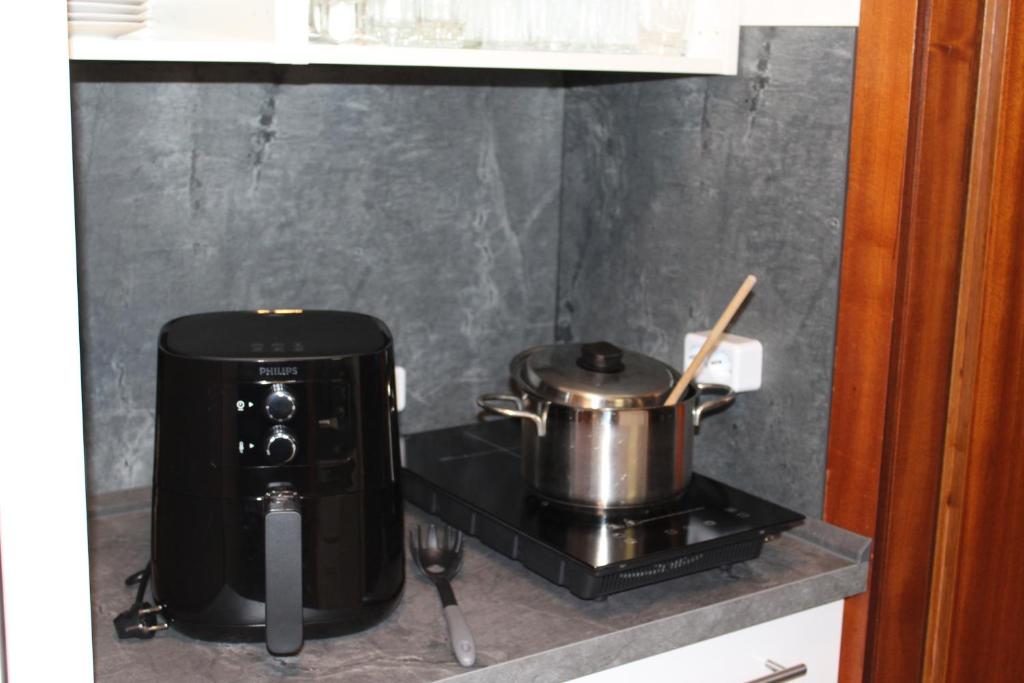 Kuchyň nebo kuchyňský kout v ubytování Appartement 21