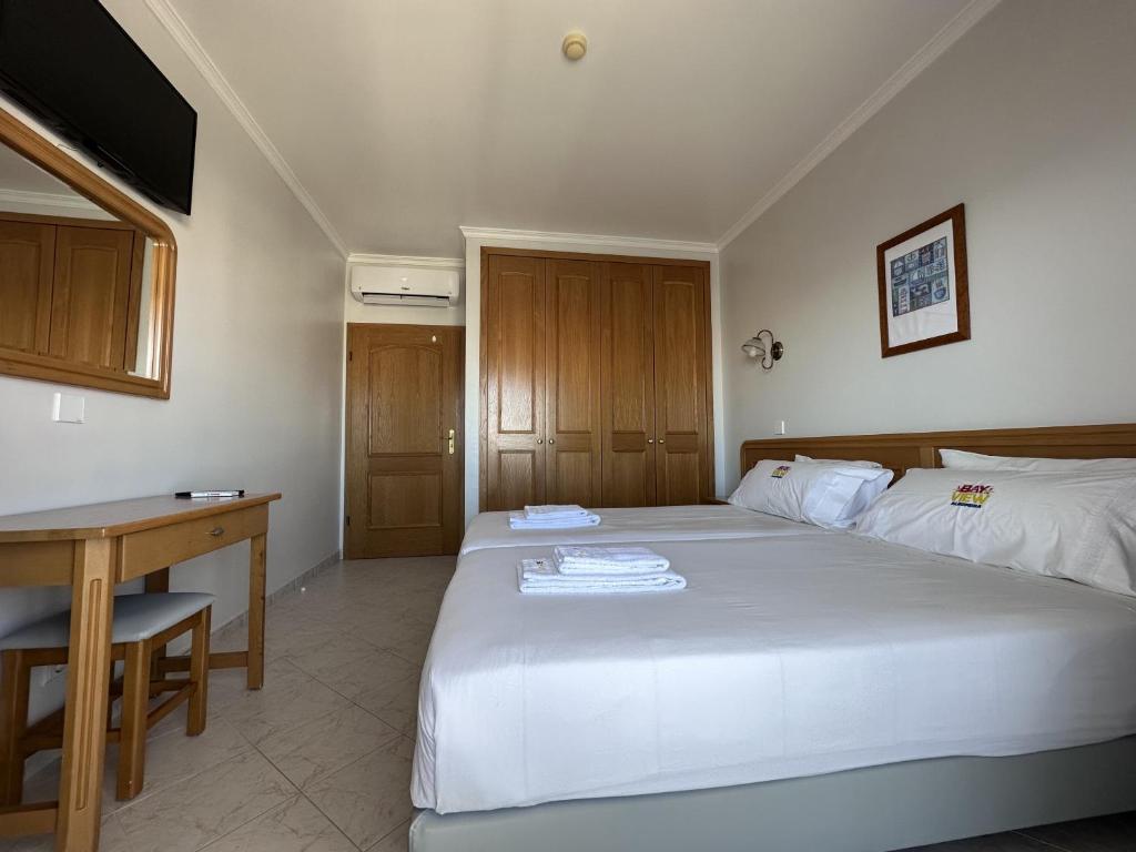 Postel nebo postele na pokoji v ubytování BayView Albufeira
