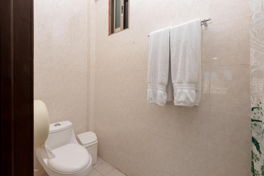 Um banheiro em Hotel Kinich