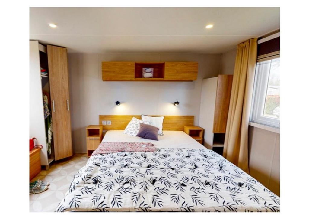 Postel nebo postele na pokoji v ubytování Mobilhomes Quiberon Camping Conguel - Bord de Mer