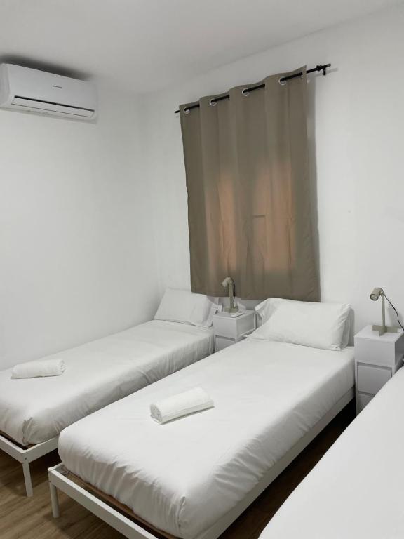 Posteľ alebo postele v izbe v ubytovaní Apartamentos Tarradellas Sants Estació