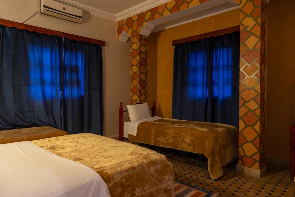 Postel nebo postele na pokoji v ubytování Hotel Marmar