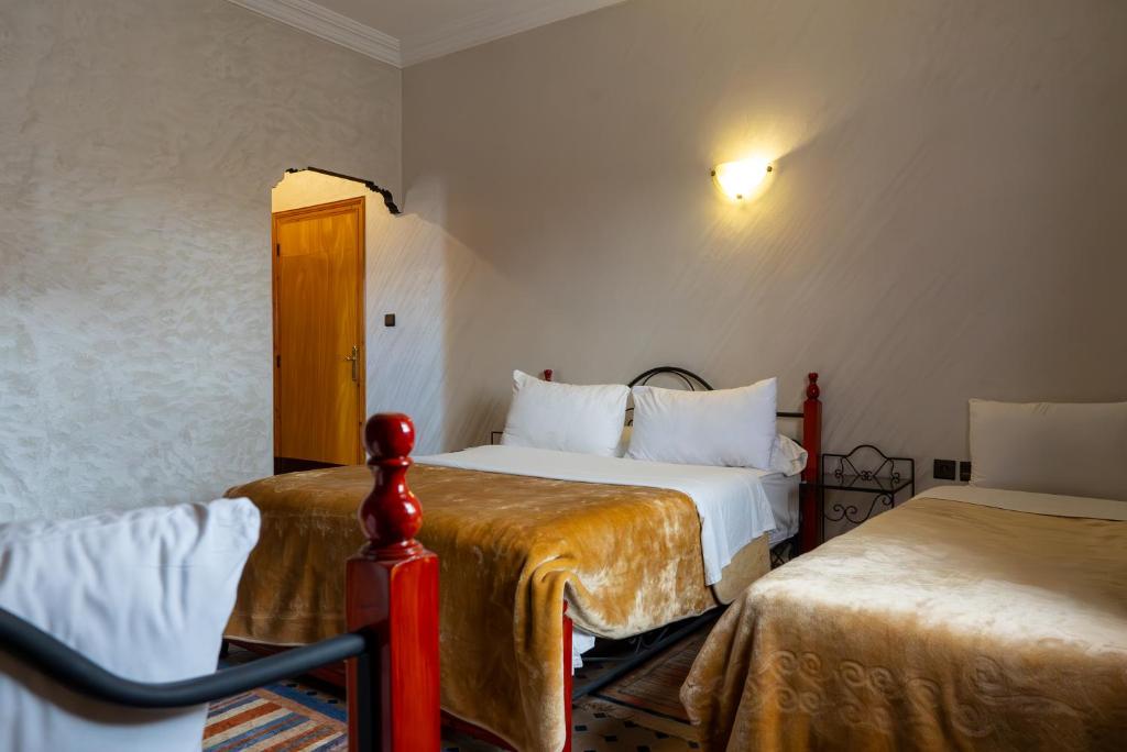 Postel nebo postele na pokoji v ubytování Hotel Marmar