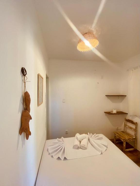Postel nebo postele na pokoji v ubytování Vilare Pousada