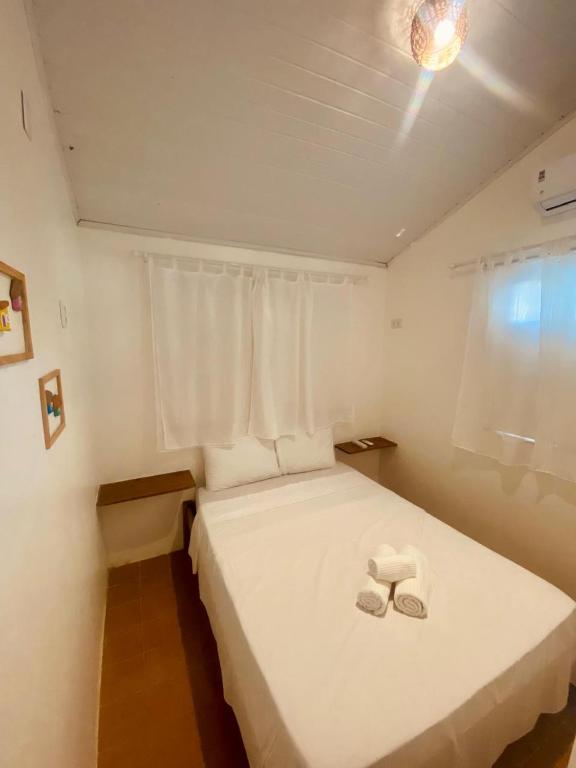 Postel nebo postele na pokoji v ubytování Vilare Pousada