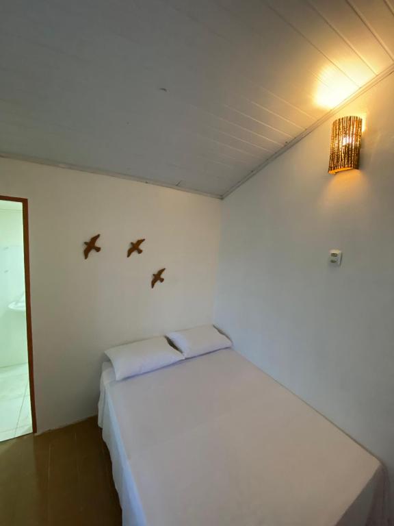 Postel nebo postele na pokoji v ubytování Vilare Pousada