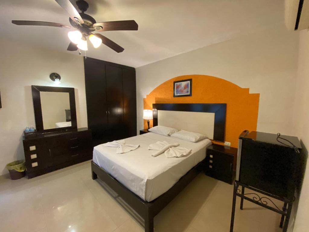 Postel nebo postele na pokoji v ubytování Hotel Quinta Marciala MX