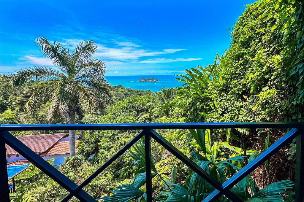 a view of the ocean from a balcony at Villa Roca Boutique Resort & Suites - ADULT ONLY in Manuel Antonio