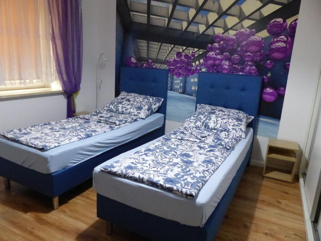Posteľ alebo postele v izbe v ubytovaní Apartament Kraszewskiego