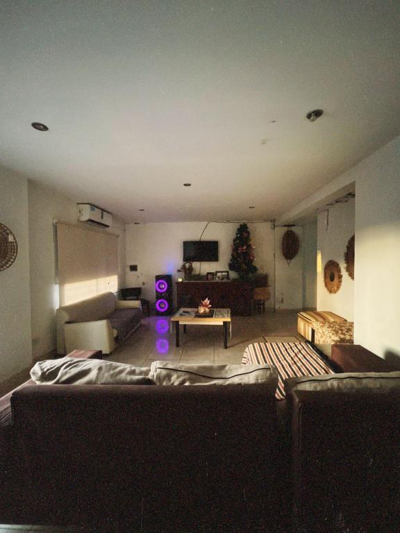 a living room with a couch and a table at Casa de luz in Posadas