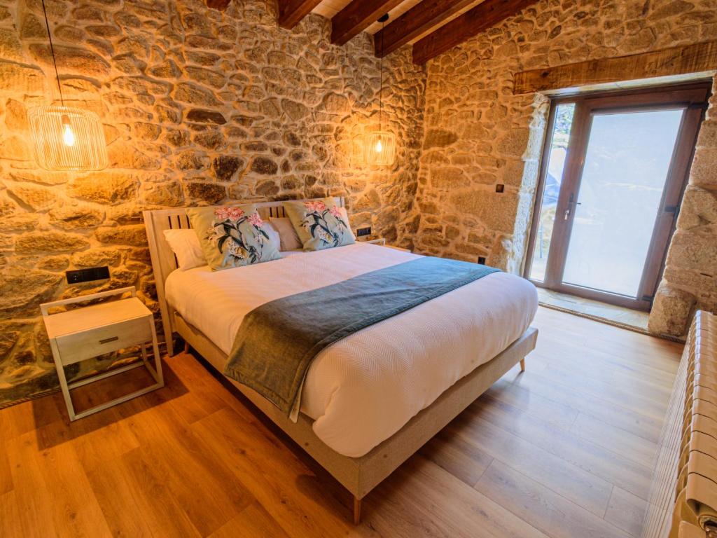 Postel nebo postele na pokoji v ubytování Casa Escondida Aveiga
