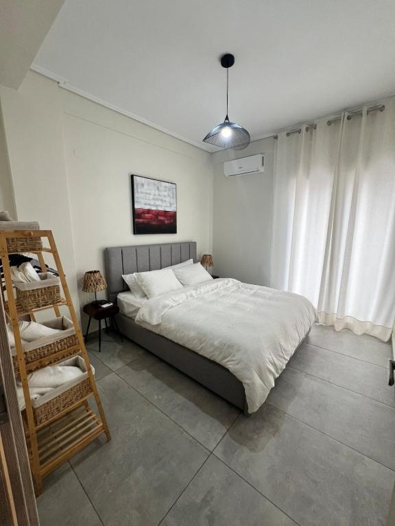 Postel nebo postele na pokoji v ubytování Feels Like Home - Agrinio Suites