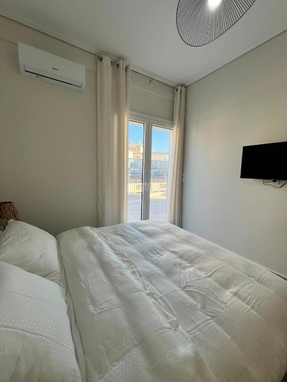 Postel nebo postele na pokoji v ubytování Feels Like Home - Agrinio Suites
