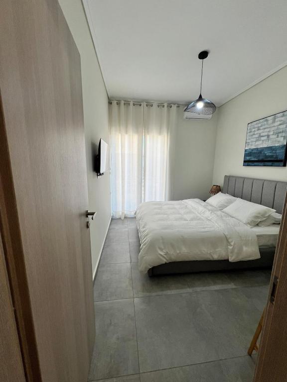Postel nebo postele na pokoji v ubytování Feels Like Home - Agrinio Suites