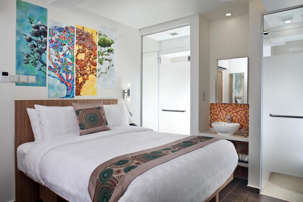 Кровать или кровати в номере Hotel Clover The Arts