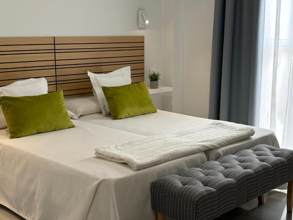 Postel nebo postele na pokoji v ubytování Hotel Lince