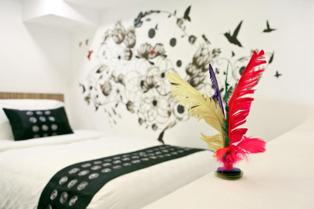Кровать или кровати в номере Hotel Clover The Arts