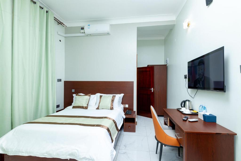 Postel nebo postele na pokoji v ubytování Ngabu Hotel